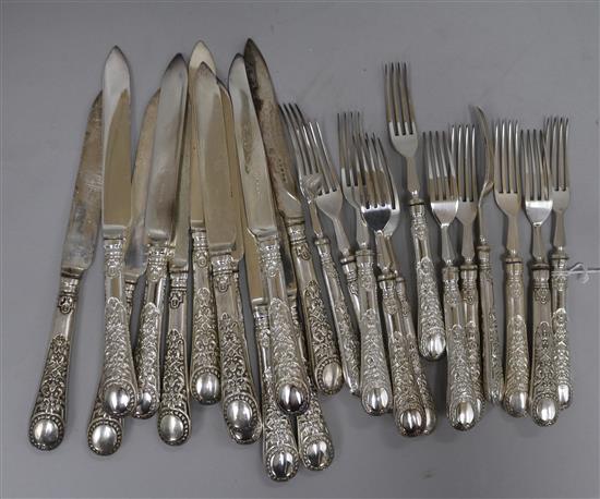 Twelve pairs of silver plated dessert eaters.